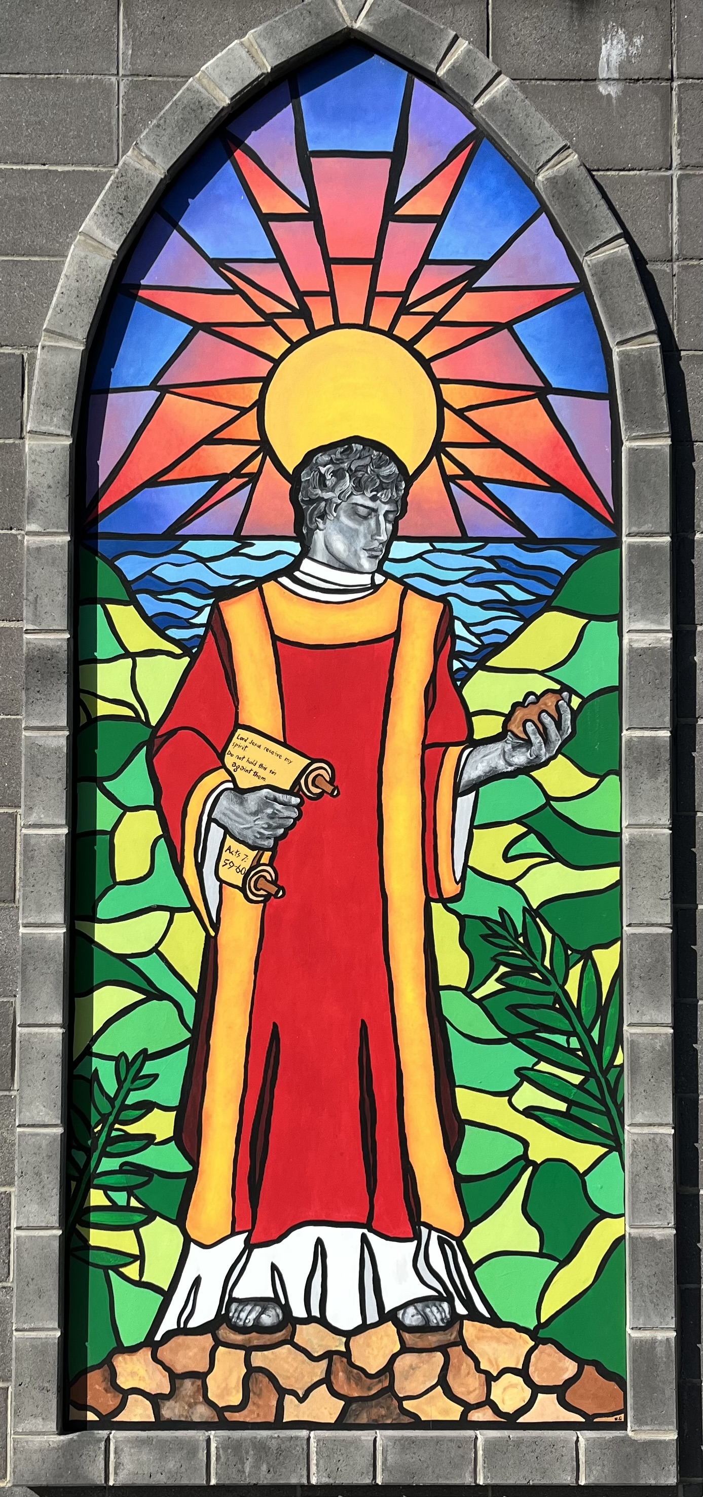 St Stephen depicted in a stained glass image.